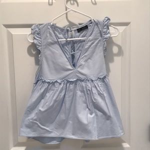 Zara, small. Light blue baby doll top with details on shoulders and back.